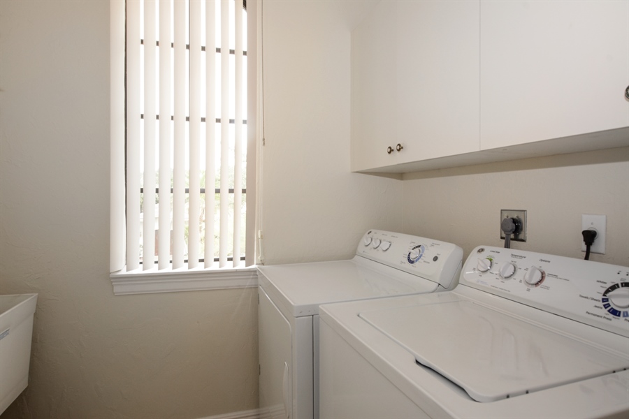 Real Estate Photography - 6986 Spyglass Ave, Parkland, FL, 33076 - Laundry Room