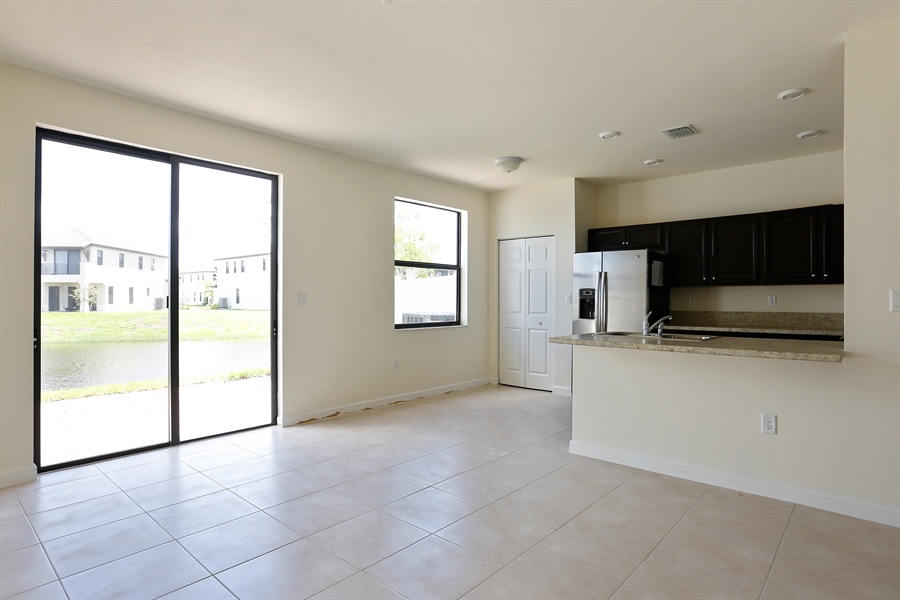 Real Estate Photography - 0 W 94 TER, 3381, Hialeah, FL, 33018 - Family Room / Kitchen