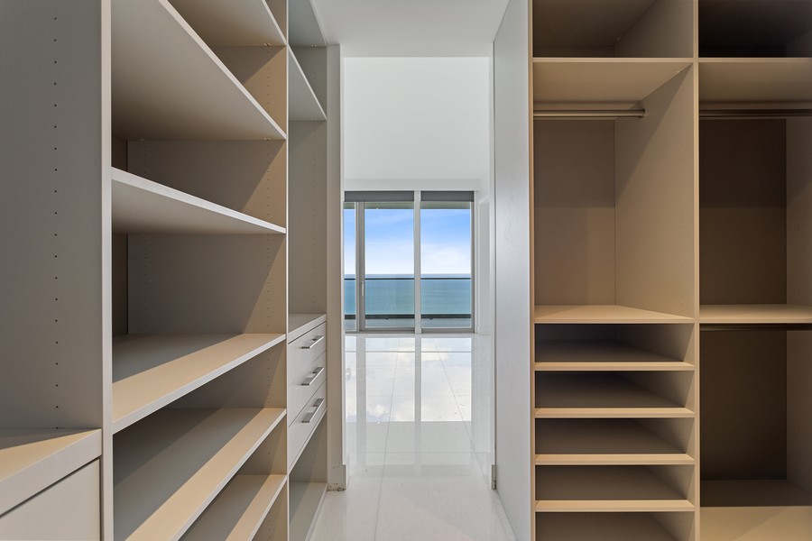 Real Estate Photography - 18975 collins avenue 4602, Sunny Isles Beach, FL, 33160 - Primary Bedroom Closet