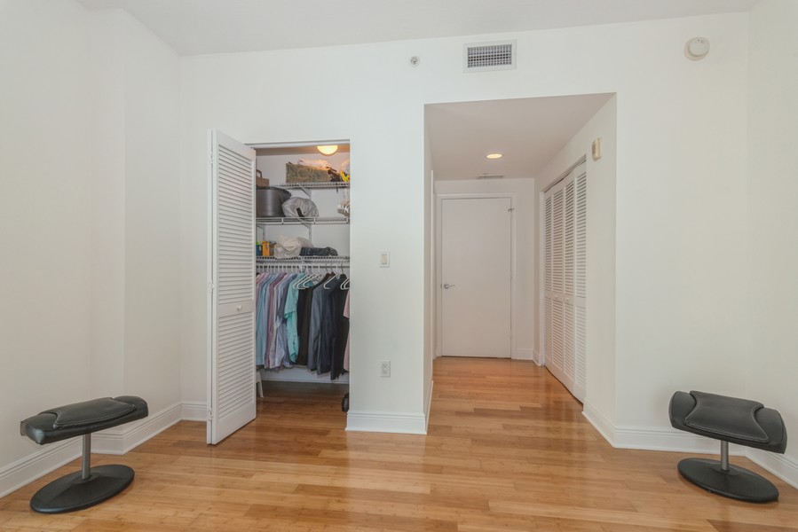Real Estate Photography - 7285 SW 90th St, Unit D613, Miami, FL, 33156 - Primary Bedroom Closet