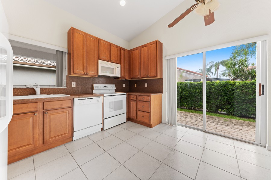 Real Estate Photography - 7344 Chorale Road, Boynton Beach, FL, 33437 - Kitchen / Breakfast Room