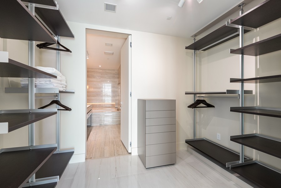 Real Estate Photography - 18975 Collins Ave. #1803, Sunny Isles, FL, 33160 - Primary Bedroom Closet
