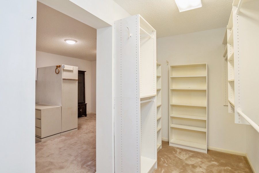Real Estate Photography - 3928 LIve Oak Boulevard, Delray Beach, FL, 33445 - Primary Walk In Closet/Dressing Room