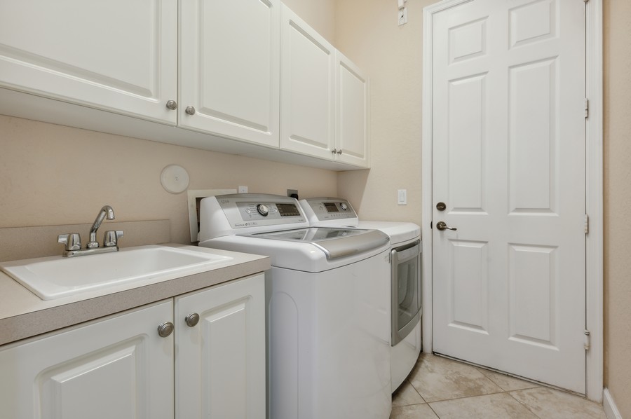 Real Estate Photography - 15660 Glencrest Avenue, Delray Beach, FL, 33446 - Laundry Room