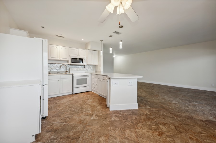 Real Estate Photography - 1201 S Riverside Drive #107, Pompano Beach, FL, 33062 - Kitchen / Living Room