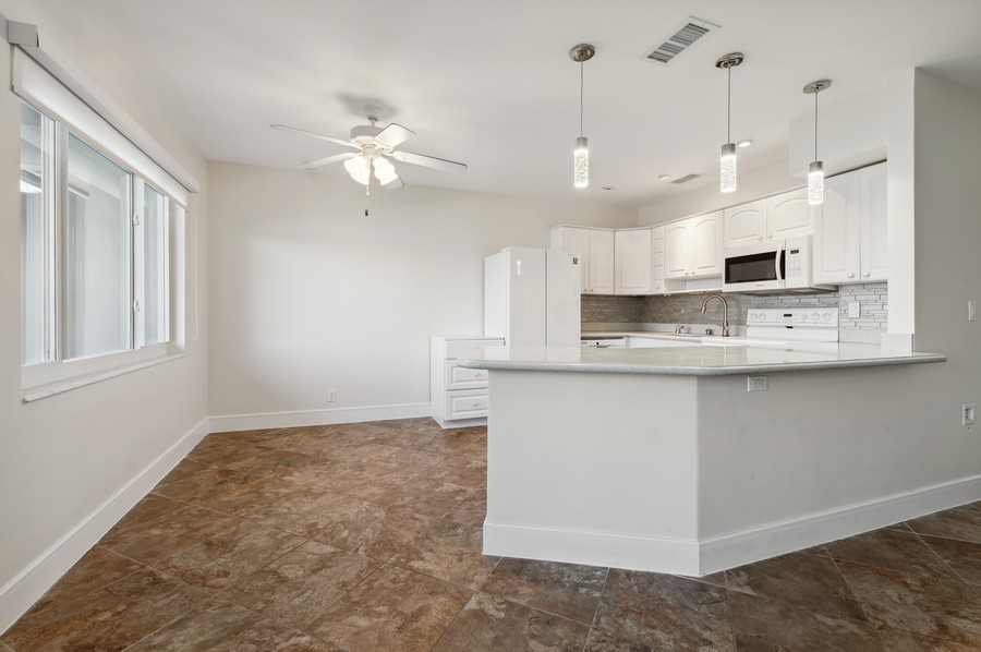 Real Estate Photography - 1201 S Riverside Drive #107, Pompano Beach, FL, 33062 - Kitchen / Dining Room