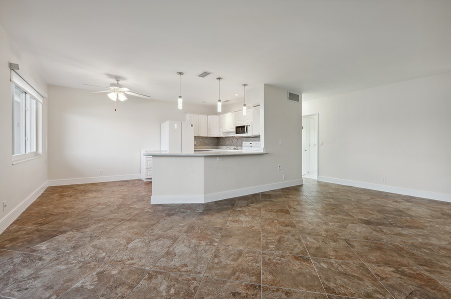 Real Estate Photography - 1201 S Riverside Drive #107, Pompano Beach, FL, 33062 - Living Room/Dining Room