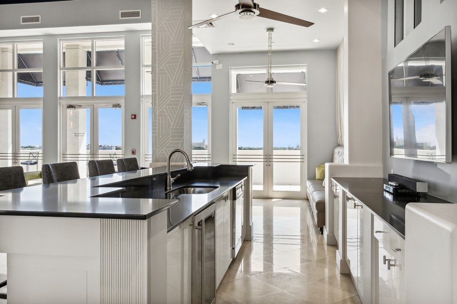 Real Estate Photography - 255 Evernia St, Unit 403, West Palm Beach, FL, 33401 - Clubhouse kitchen