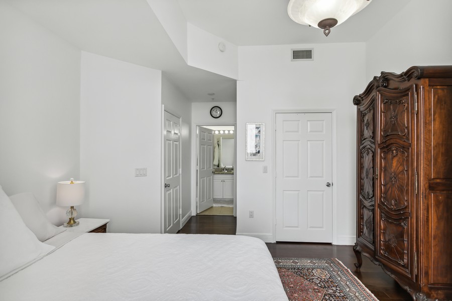 Real Estate Photography - 255 Evernia St, Unit 403, West Palm Beach, FL, 33401 - Bedroom into bathroom