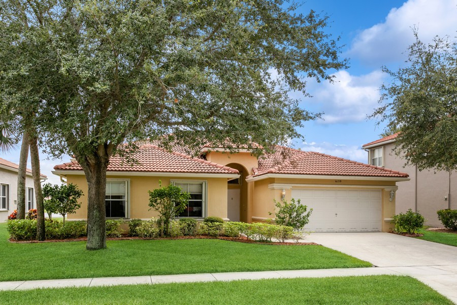Real Estate Photography - 6159 Shadow Tree Ln, Lake Worth, FL, 33463 - Tile Roof; Accordion Shutters