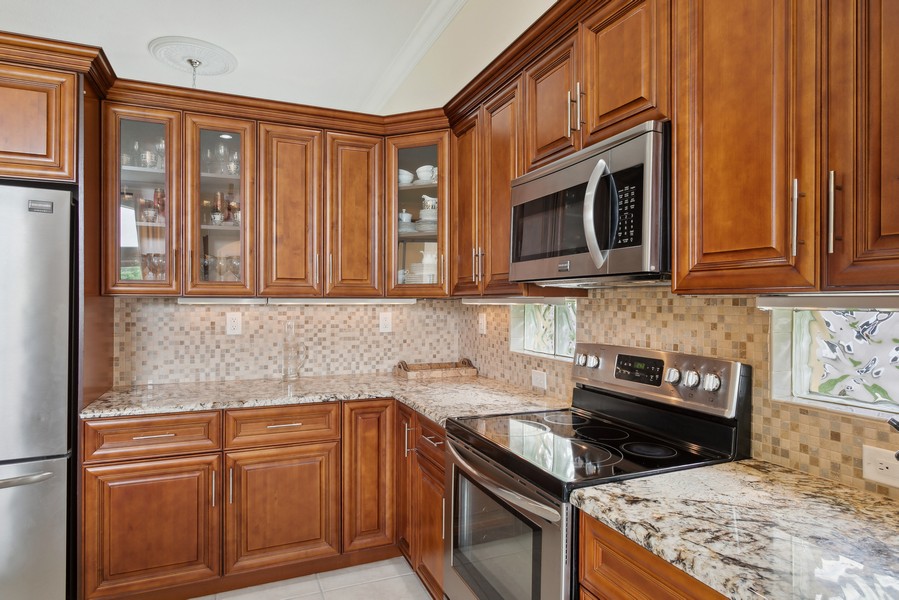 Real Estate Photography - 6159 Shadow Tree Ln, Lake Worth, FL, 33463 - Granite and Wood Cabinets
