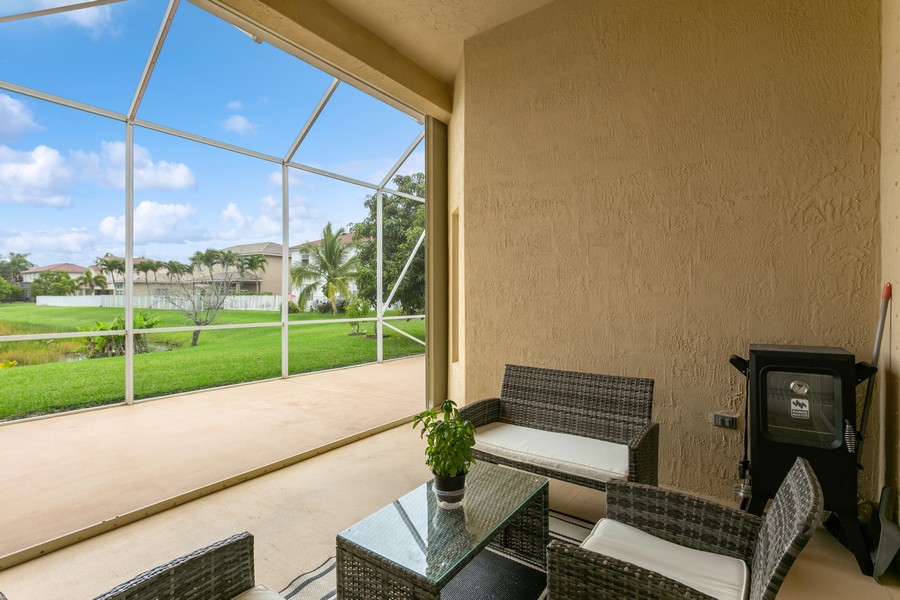 Real Estate Photography - 6159 Shadow Tree Ln, Lake Worth, FL, 33463 - Screen Enclosed Covered & Open Patio