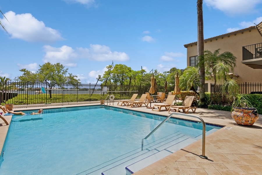 Real Estate Photography - 310 Via Villagio, Hypoluxo, FL, 33462 - Pool overlooking tropical Mangrove Estuary