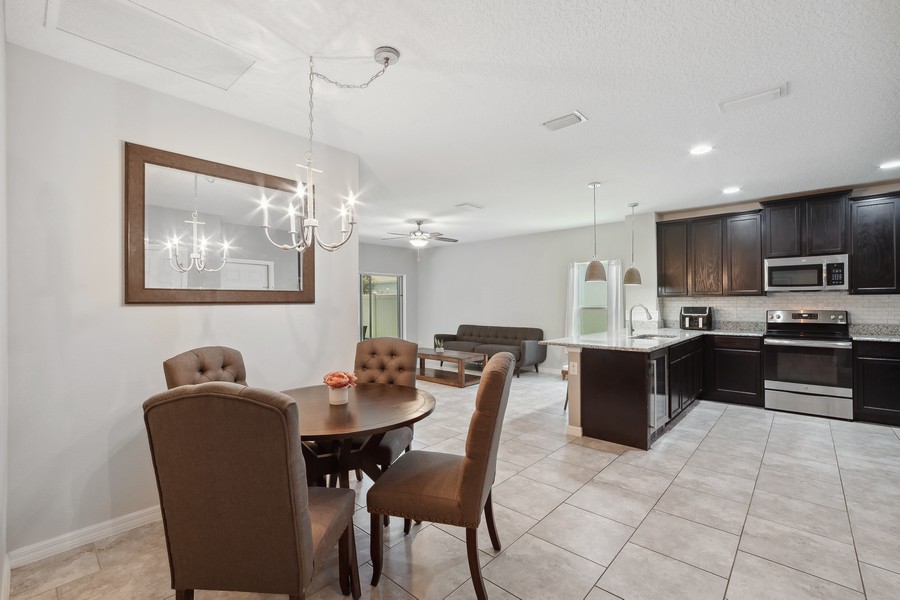 Real Estate Photography - 26026 Meadow Breeze Lane, Leesburg, FL, 34748 - Dining Room