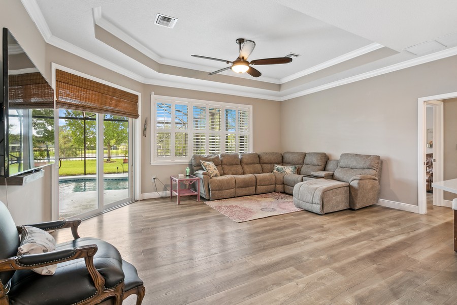 Real Estate Photography - 472 SW Vista Lake Drive, Port Saint Lucie, FL, 34953 - Family Living area w Coffered Ceilings