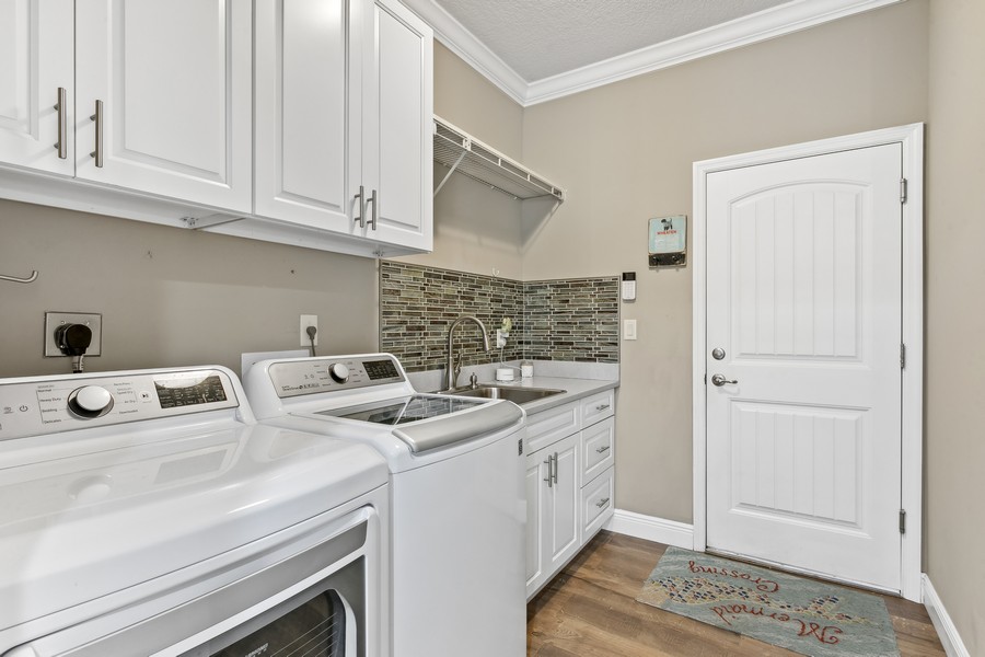 Real Estate Photography - 472 SW Vista Lake Drive, Port Saint Lucie, FL, 34953 - Laundry Room with Full size W/D