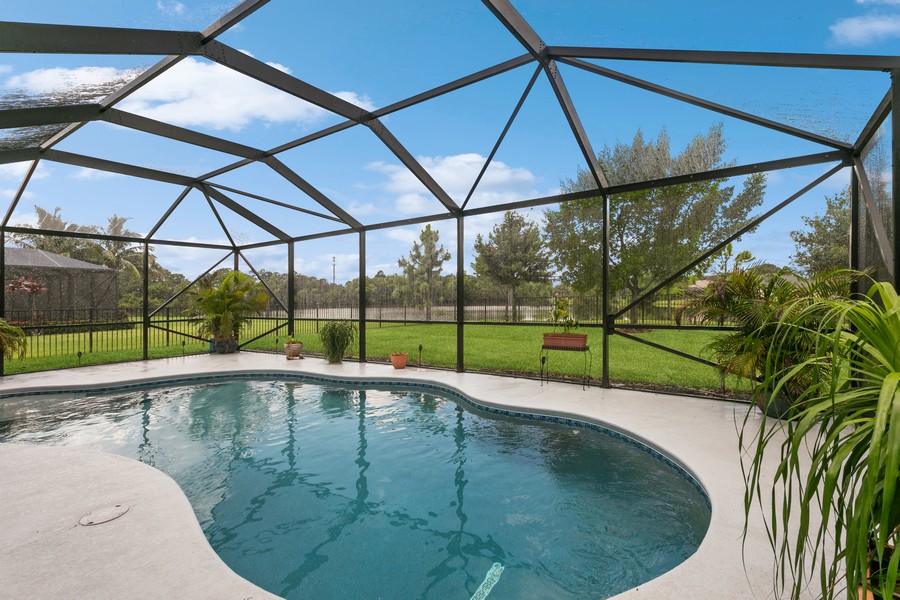 Real Estate Photography - 472 SW Vista Lake Drive, Port Saint Lucie, FL, 34953 - Free Form Pool - Screen Enclosed Patio