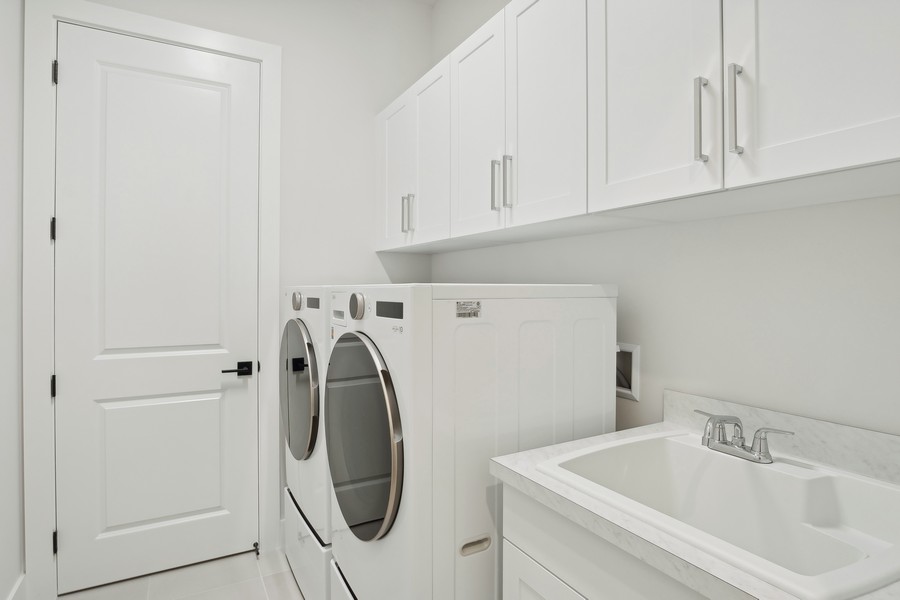 Real Estate Photography - 10061 Regency Way, West Palm Beach, FL, 33412 - Laundry Room